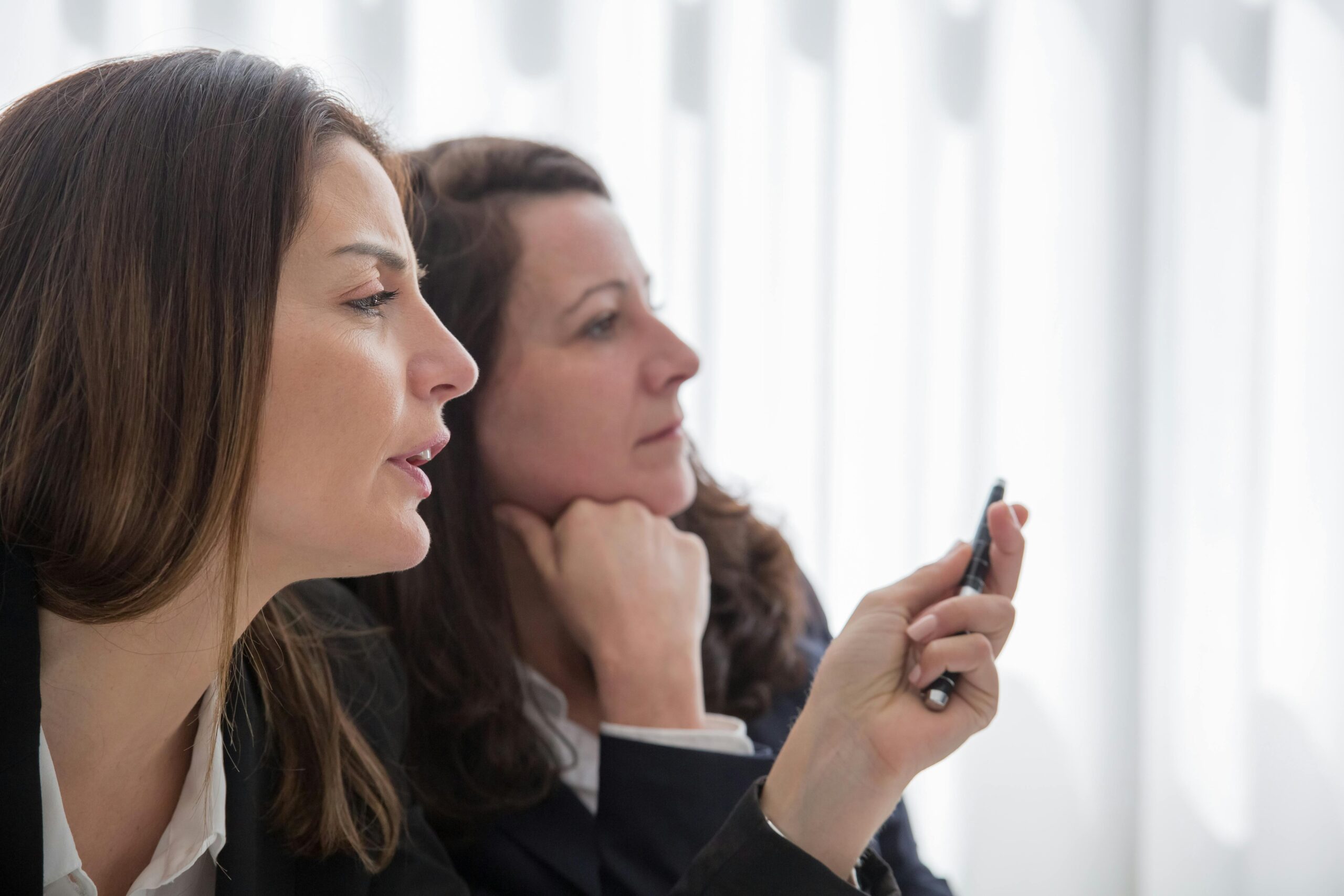 Two women reviewing information together during a consultation.